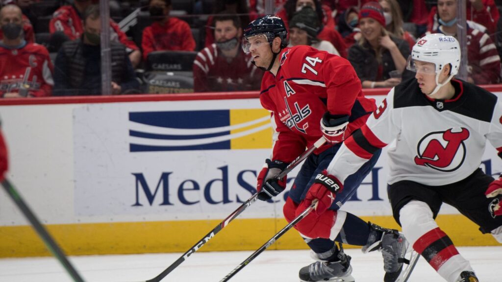 John Carlson and Jesper Bratt in game of New Jersey Devils vs Washington Capitals